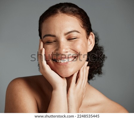 Face, beauty and satisfaction with a model black woman in studio on a gray background to promote natural skincare. Facial, wellness and makeup with an attractive young female happy with cosmetics Royalty-Free Stock Photo #2248535445