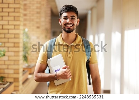 Face portrait, student and man in university ready for back to school learning, goals or targets. Scholarship, education and happy, confident and proud male from India holding tablet for studying. Royalty-Free Stock Photo #2248535531