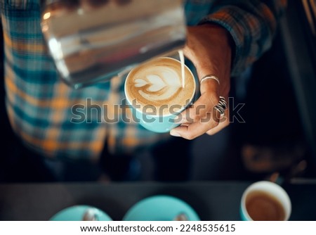 Coffee, milk and hands of man in cafe for cappuccino, breakfast and caffeine beverage. Relax, espresso and dairy with barista in coffee shop with latte art for retail, mocha and drink preparation Royalty-Free Stock Photo #2248535615