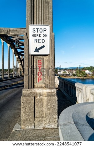 Illuminated stop sign on the northbound direction of the Siuslaw River Bridge, Florence, Oregon, USA