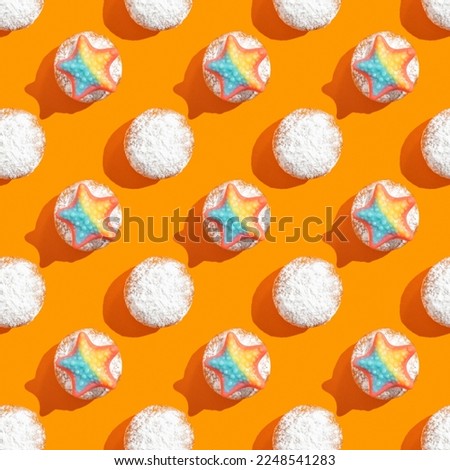 Seamless pattern with marine theme shortcakes on orange background.