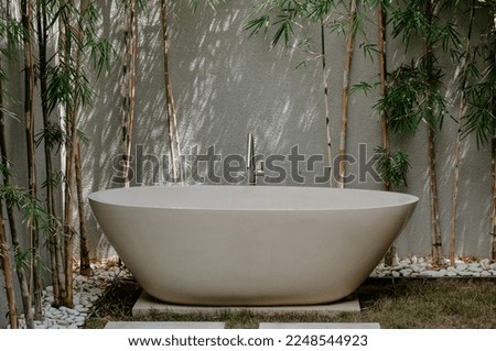 A freestanding bath in a luxury rental house in Bali, Indonesia.  Royalty-Free Stock Photo #2248544923
