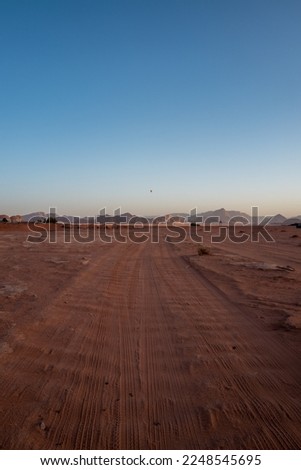 Tracks cutting through the desert at Wadi Rum, Jordan.