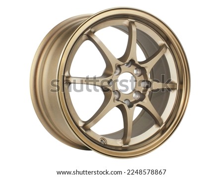 car wheel alloy wheel of gold color isolated on a white background.