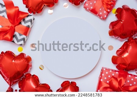 Podium or pedestal and gift boxes with red heart shape balloons on white background. Valentines Day template. High quality photo