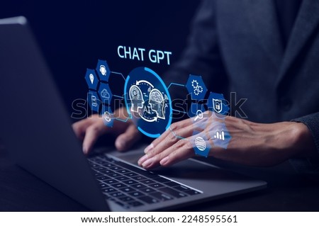 ChatGPT Chat with AI or Artificial Intelligence technology. businessman using a laptop computer chatting with an intelligent artificial intelligence. Developed by OpenAI. Futuristic technology. Royalty-Free Stock Photo #2248595561