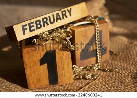  concept of day of valentine with the date written on wooden cubes