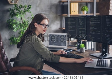 Profile side photo of professional hacker working content safety site use modern devices write information indoor room workstation