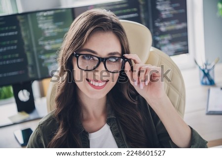 Photo of happy smiling lady it expert wear glasses writing secure code indoors workstation workshop