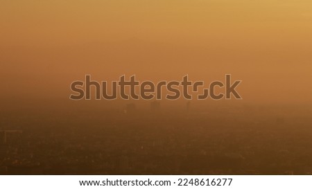 blurred of PM 2.5 smoke that builds up over Chiang Mai during dry season and PM 2.5 dust is still health concern for Chiang Mai people because PM 2.5 dust levels exceed health safety standards. Royalty-Free Stock Photo #2248616277