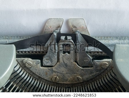 Old typewriter ready to type a note