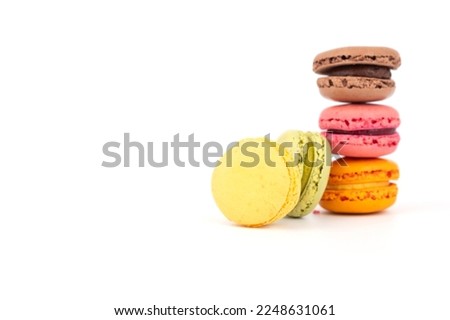 Delicious colorful macarons sweets, favorite small cakes isolated on white background