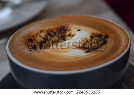 
Soft focus on latte coffee cup - vintage effect process pictures
Cup of coffee with beautiful Latte art on wood table. coffee shop concept ,Delicious in the morning.
