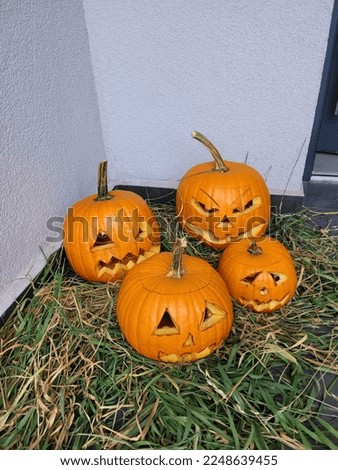 Halloween decoration with scary faces made of pumpkin
