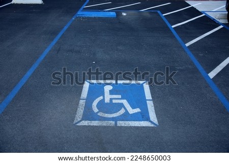 Handicap Parking Space. Handicap Placard. Wheel Chair Logo. Reserved Parking Space. No Parking unless permuted. 