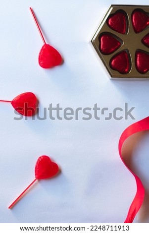 
valentines day background with gifts, hearts and red ribbons decorating
white background with place for text design