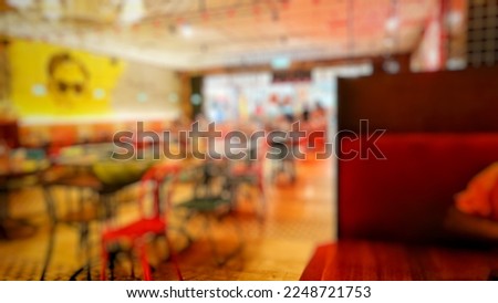 Blurred background abstract and can be illustration to article of Tables and chairs in restaurant