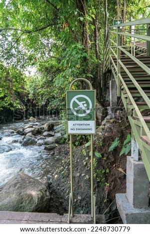 sign not to swim in the river
