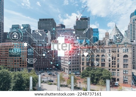 Financial downtown city view panorama of Boston from Harbor area at day time, Massachusetts. Glowing healthcare digital medicine icons. The concept of treatment from disease, Threat of pandemic