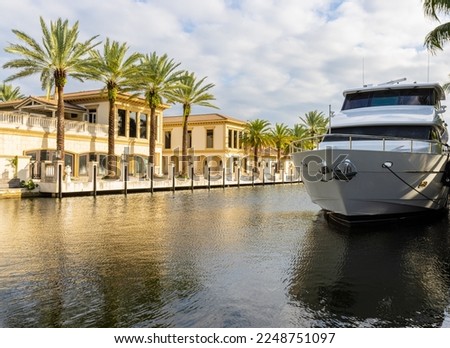 Yacht Moored With Luxury Homes on Las Olas Drive, Fort Lauderdale, Florida , USA Royalty-Free Stock Photo #2248751097