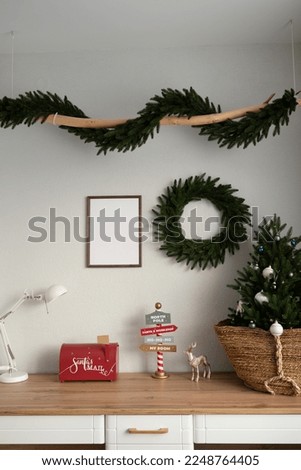Mockup of a wooden frame in the interior of a room decorated for Christmas