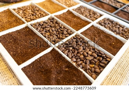 coffee beans close-up. Various types of coffee. whole grains and ground coffee on the counter in the store.