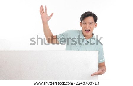 Portrait photo of a young handsome cheerful smile adult man, hold a blank empty white card with copy space to write message on, isolated on white background. Concept of banner advertising.