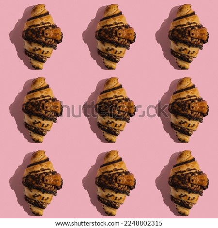 Seamless pattern with chocolate croissant on pink background.