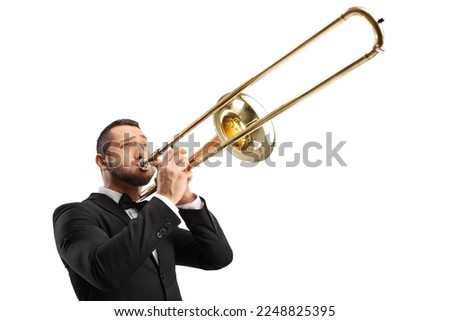Elegant young man playing a trombone isolated on white background Royalty-Free Stock Photo #2248825395