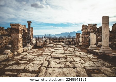 street with white marble pavement among ruins of the ancient city Laodicea in Turkey Royalty-Free Stock Photo #2248841131