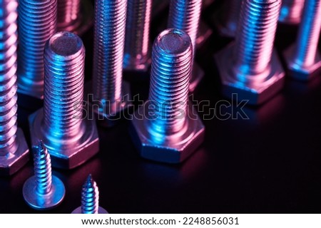 Set of bolts nuts nails metal fasteners. Consumable hardware tools. assortment steel screws collection close up background Royalty-Free Stock Photo #2248856031