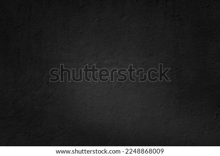 Old black grunge background. Dark concrete wall tetxure. Blackboard for text and inscriptions