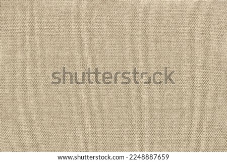 Beige cotton woven sofa cushion fabric texture background. High resolution photography