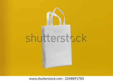 Non Woven Fabric Bag with a yellow background
