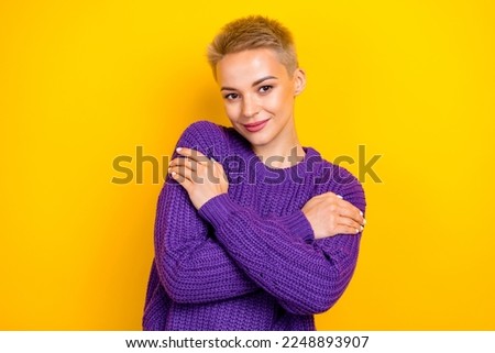 Photo of young model blonde short hair embrace hugs her new favorite purple sweater fresh clothes after washing isolated on yellow color background Royalty-Free Stock Photo #2248893907