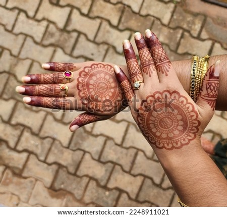 Henna Art. Henna Design is mainly used in celebration of special occasions or in the joyous gathering of people. Royalty-Free Stock Photo #2248911021