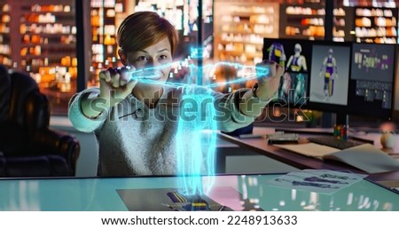 Female Fashion Designer Working with Holographic Augmented Reality 3D Model. Young Woman Creating New Clothing Collection. Scientific Technology. Fashion and Art Concept. . High quality photo