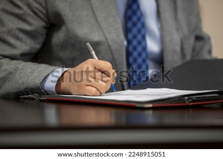 Businessman Signing a Document ( Memur )
