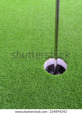 Golf hole with green grass.