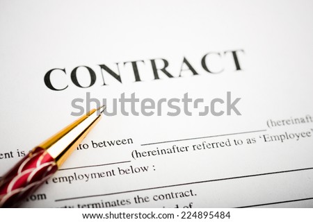 Pen on the contract papers 