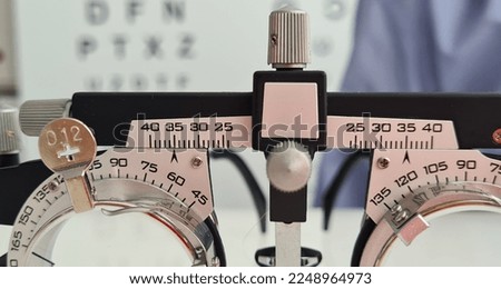 Glasses for selection of lenses in optics for glasses and ophthalmology. Farsightedness and myopia and astigmatism vision test Royalty-Free Stock Photo #2248964973