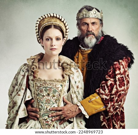 Crown, queen and king in costume isolated on studio background for medieval, renaissance and England culture. Headshot portrait of royal couple with power, wealth and vintage fashion for power