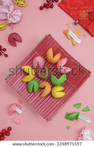 chinese fortune cookies on pink background with Chinese character "Fu" means Fortune.