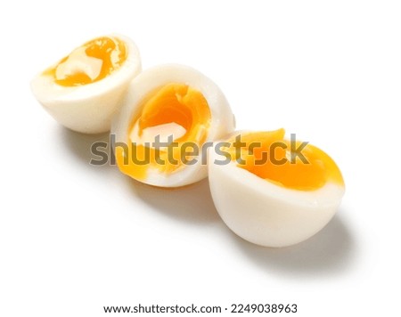 Sliced soft boiled eggs on white background Royalty-Free Stock Photo #2249038963