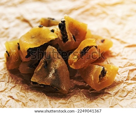 Slices of dried passion fruits on a old paper background