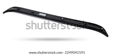 A black plastic decorative door sills in an automobile parsing for sale or repair in a workshop on a white isolated background in a photo studio.