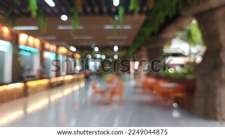 ABSTRACT BLUR CANTEEN ROOM BACKGROUND. Office building or university lobby hall blur background with blurry school hallway corridor interior view toward empty corridor entrance