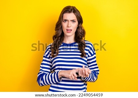 Photo portrait of attractive young woman calculate fingers scold annoyed dressed stylish striped look isolated on yellow color background Royalty-Free Stock Photo #2249054459
