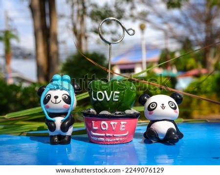 The cuteness of panda bears in the festival of love  Valentine's Day  clear image after blur