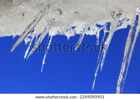 Icicles of frozen ice hanging with the roof of huts in Kaghan valley of KPK province of Pakistan. 